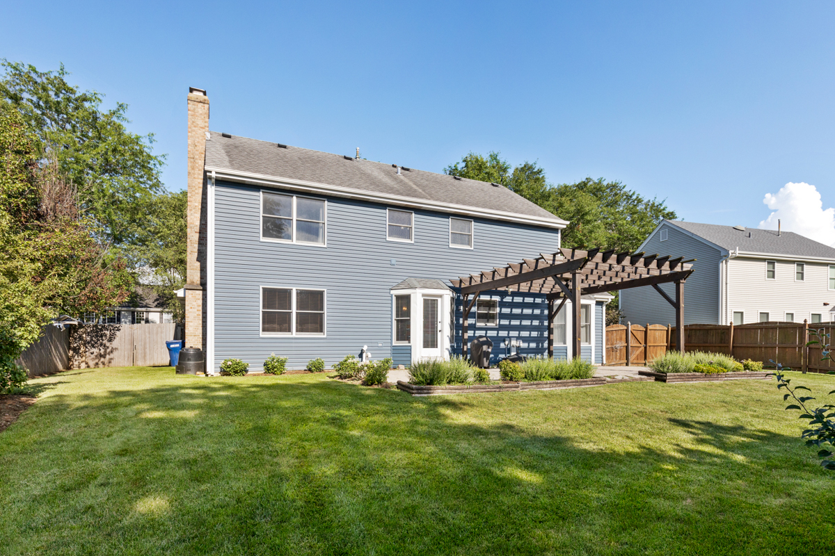 2225 Forest Ridge Road St. Charles, IL 60174 - Photo 24 of 24 a front view of a house with a yard