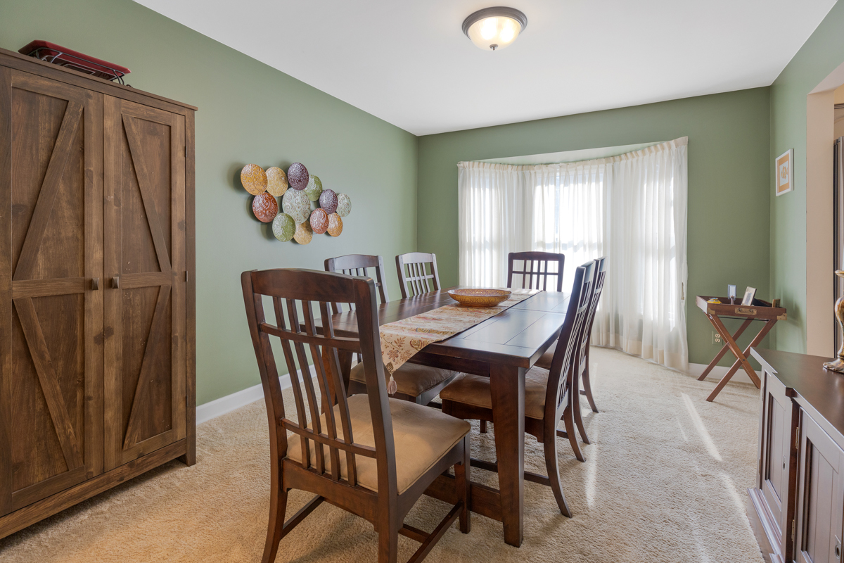 2225 Forest Ridge Road St. Charles, IL 60174 - Photo 7 of 24 a view of a dining room with furniture and a window