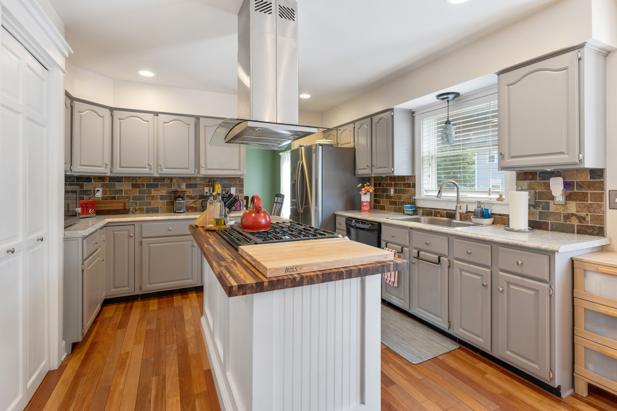 2225 Forest Ridge Road St. Charles, IL 60174 - Photo 9 of 24 a kitchen that has a lot of cabinets in it and wooden floors