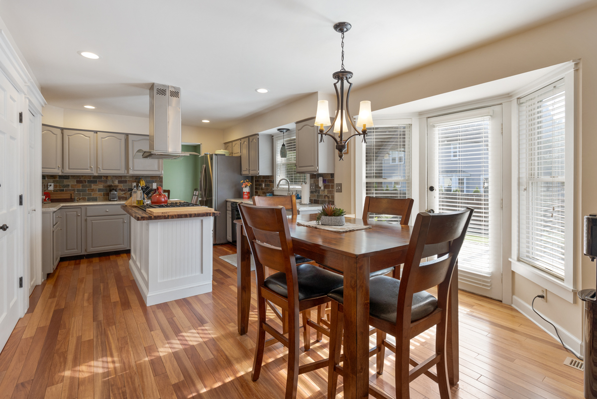 2225 Forest Ridge Road St. Charles, IL 60174 - Photo 10 of 24 a dining room with stainless steel appliances kitchen island granite countertop a dining table chairs and granite counter tops