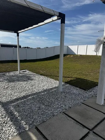 a view of a backyard of a house