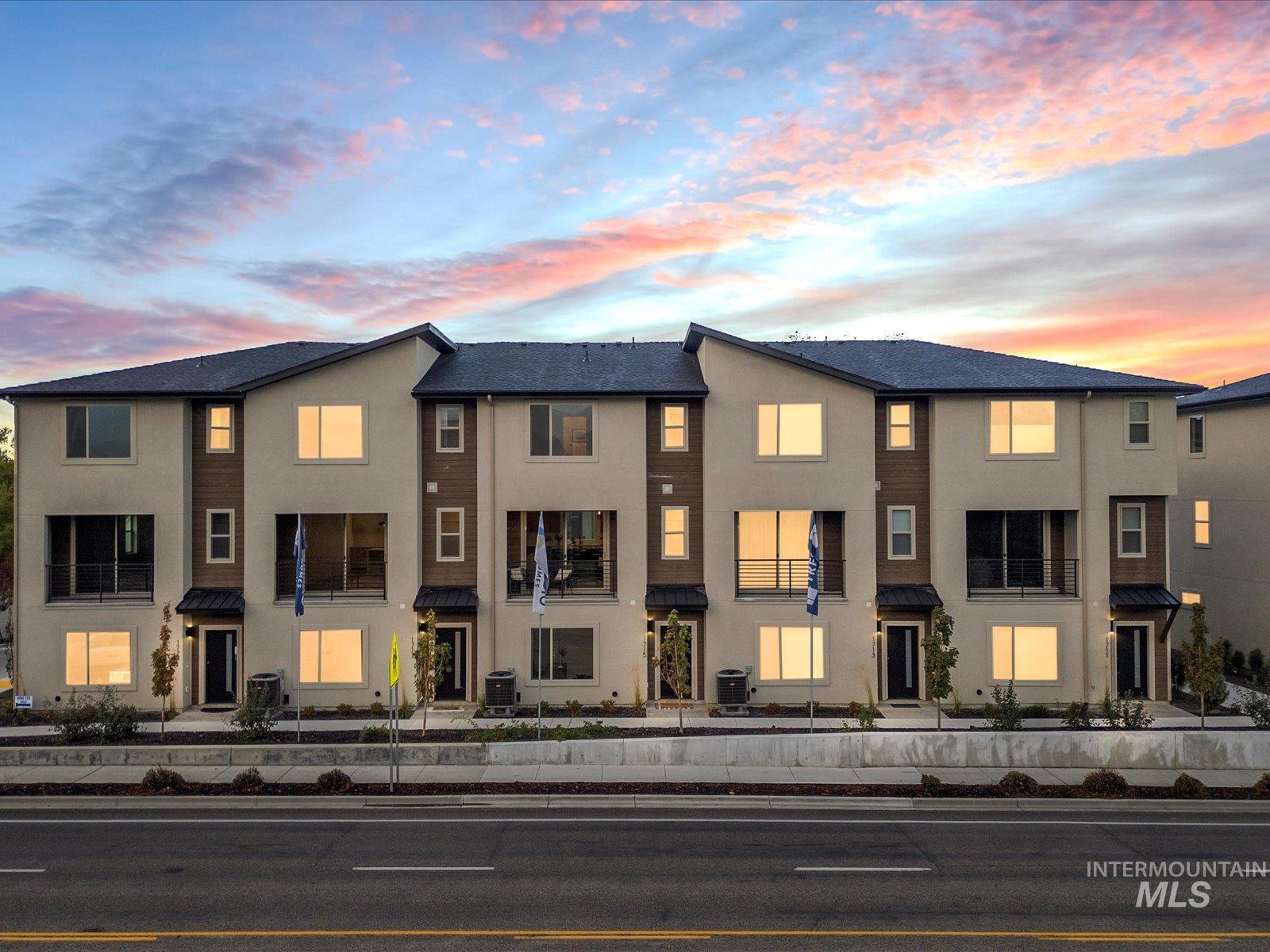 View of front of house featuring stucco siding and a residential view