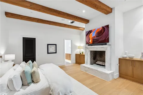 a room with furniture projector and screen