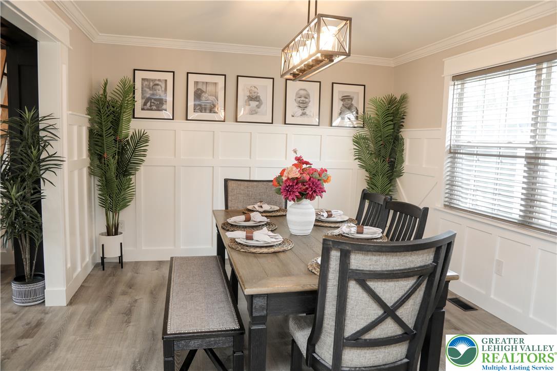 1412 Stanford Road Bethlehem, PA 18018 - Photo 11 of 58 Board and batten wainscoting and crown molding elevate this inviting dining room.