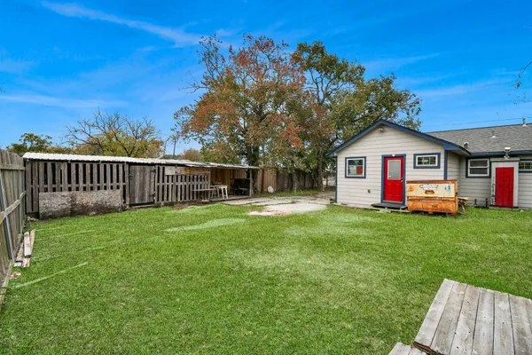 a front view of a house with yard and green space