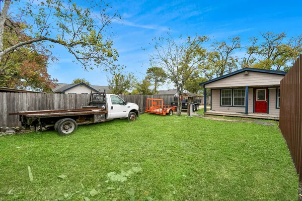 a view of house with yard and entertaining space