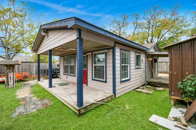 a view of a house with a yard porch and sitting area