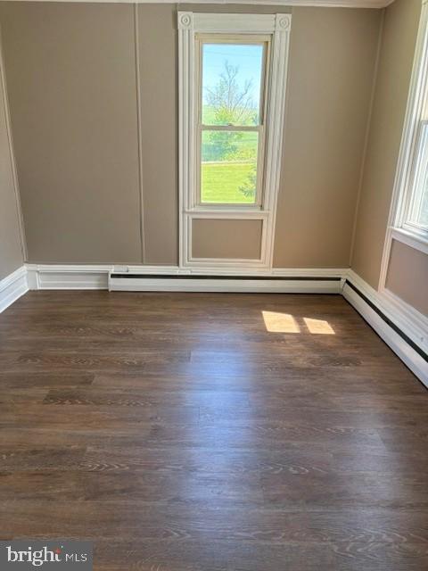 1520 Windsor Castle Road, Unit 1 Hamburg, PA 19526 - Photo 2 of 9 an empty room with wooden floor and windows