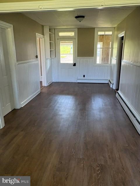 1520 Windsor Castle Road, Unit 1 Hamburg, PA 19526 - Photo 4 of 9 an empty room with wooden floor and windows