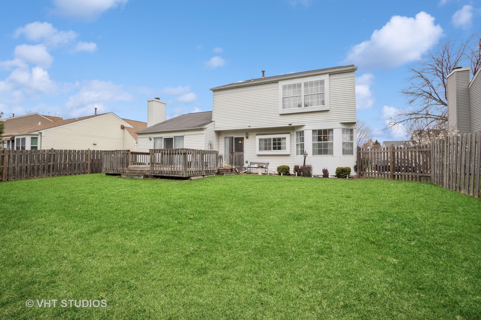 695 West Paddock Drive Wheeling, IL 60090 - Photo 18 of 18 a view of a house with a big yard and large trees