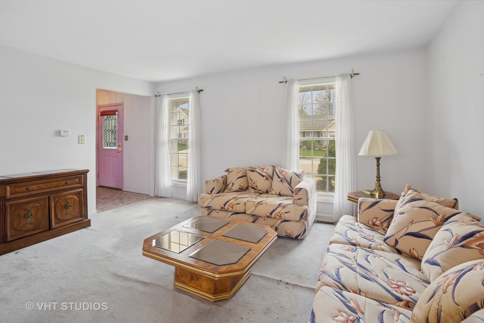 695 West Paddock Drive Wheeling, IL 60090 - Photo 2 of 18 a spacious bedroom with a bed and a couch