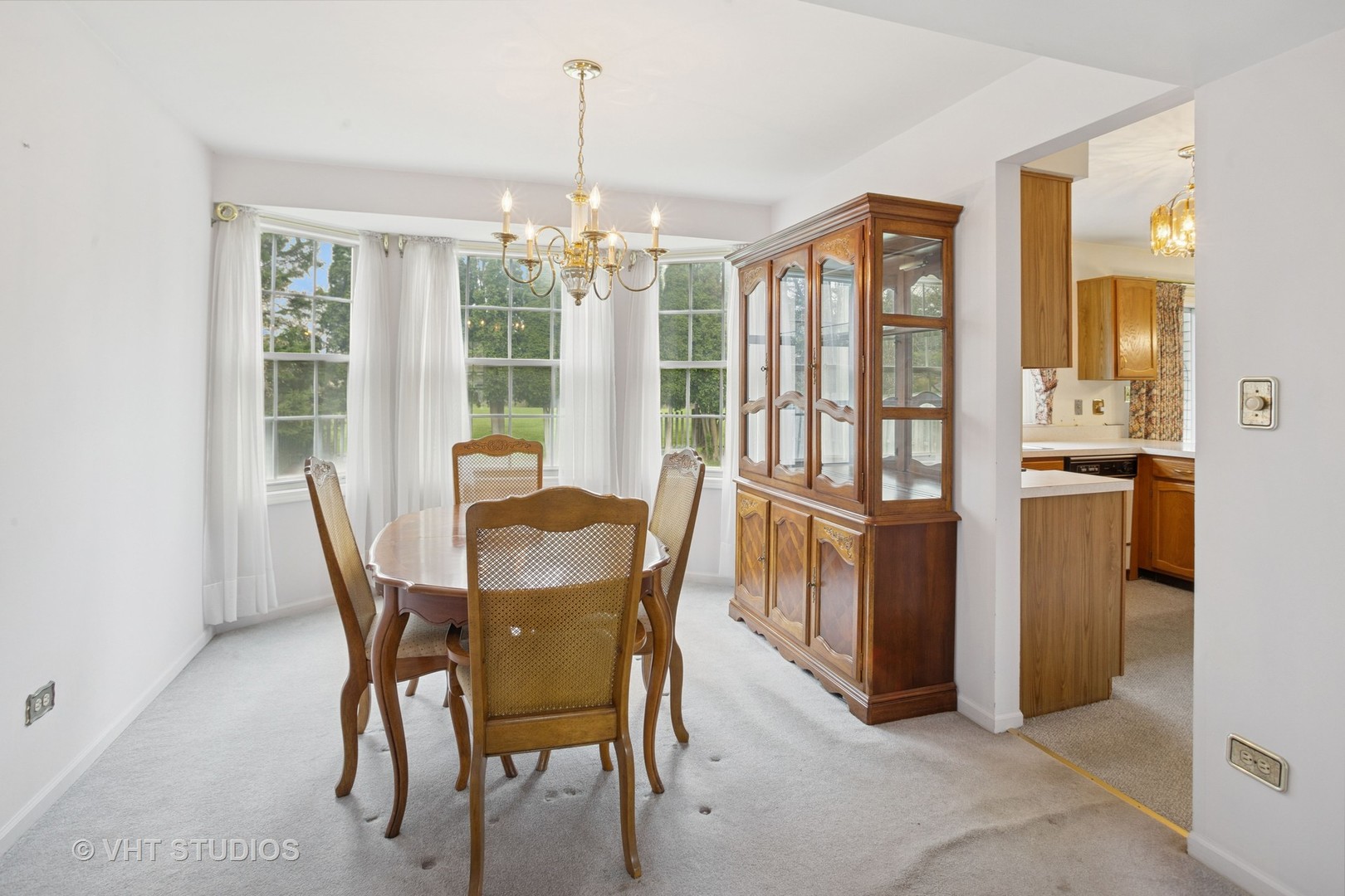695 West Paddock Drive Wheeling, IL 60090 - Photo 7 of 18 a view of a dining room with furniture window and outside view