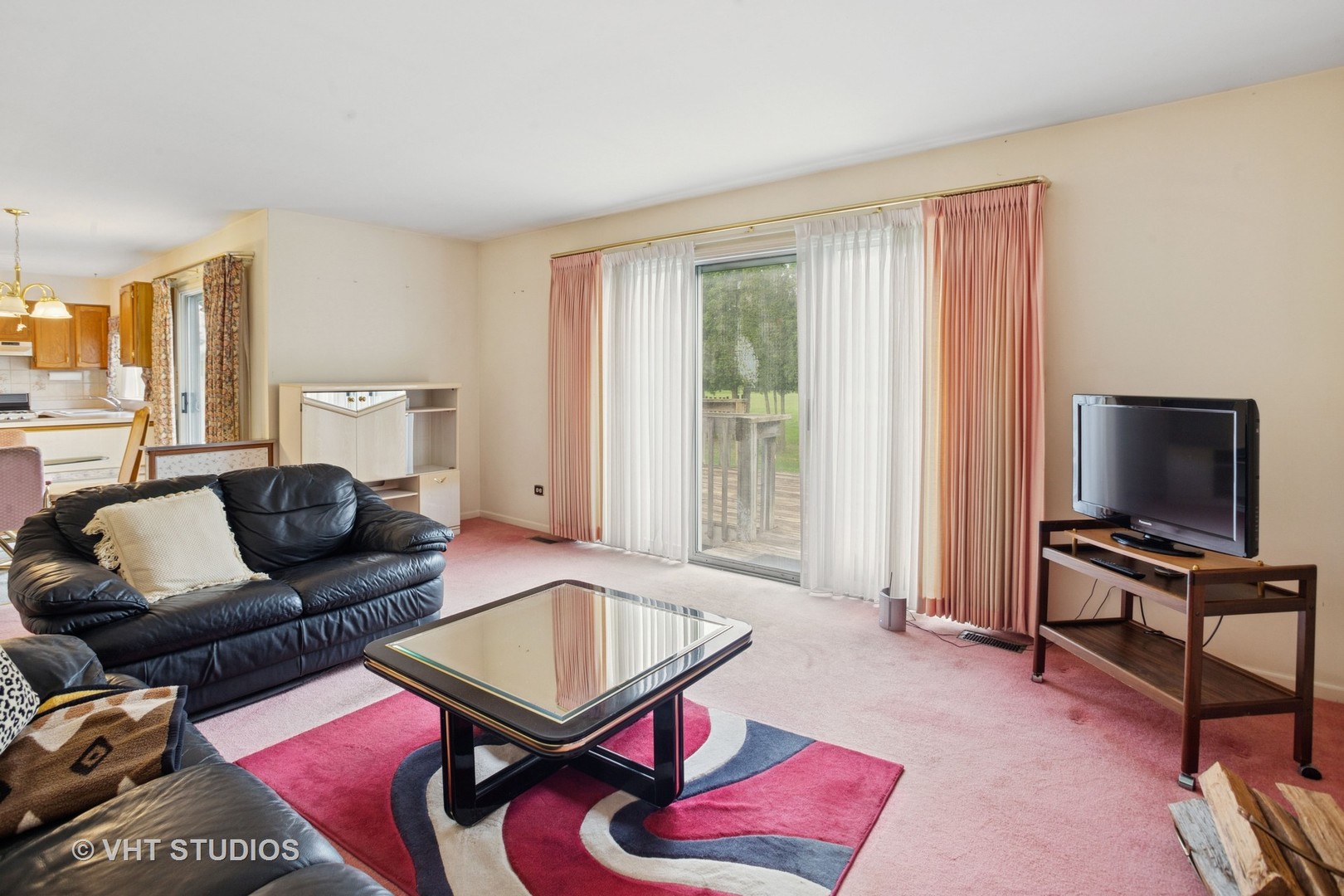 695 West Paddock Drive Wheeling, IL 60090 - Photo 9 of 18 a living room with furniture and a flat screen tv