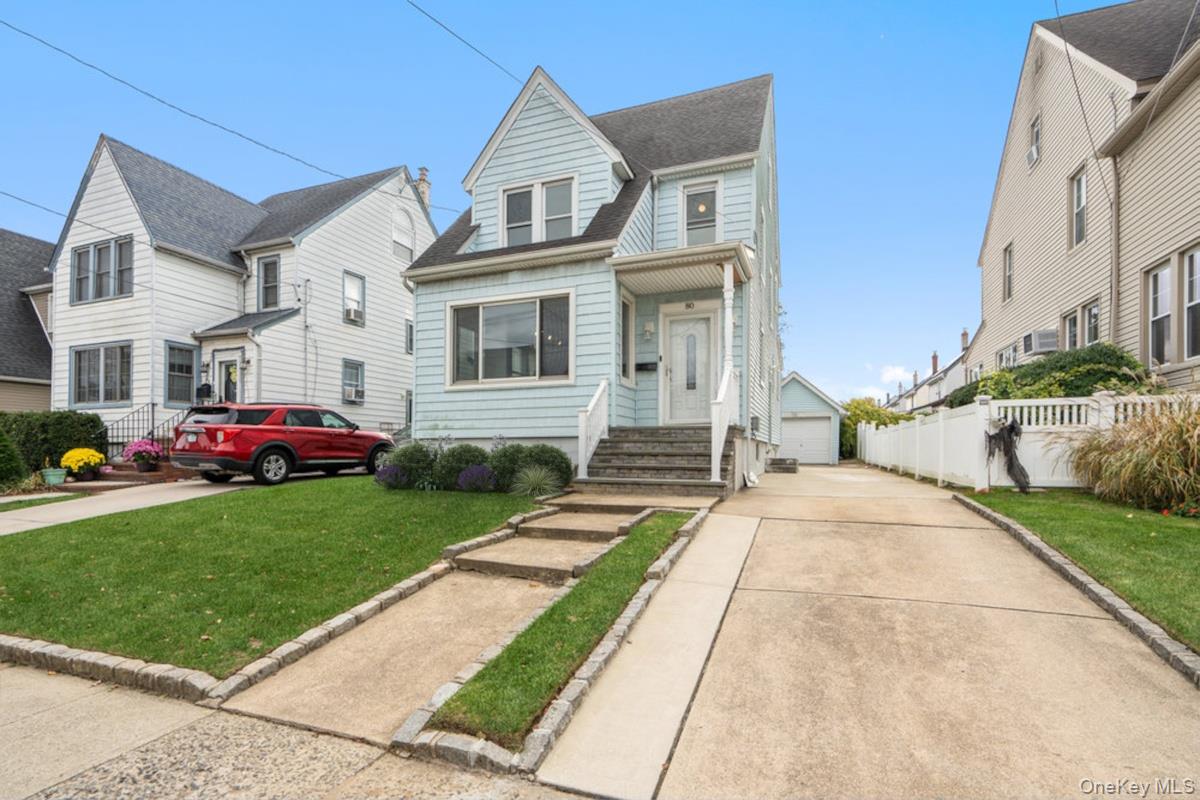 80 Munro Boulevard Valley Stream, NY 11581 - Photo 2 of 28 a front view of a house with a yard