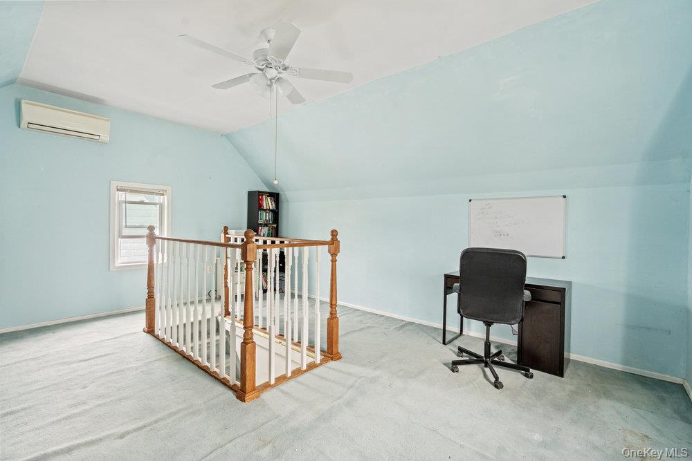 80 Munro Boulevard Valley Stream, NY 11581 - Photo 21 of 28 a view of a workspace with furniture and a ceiling fan