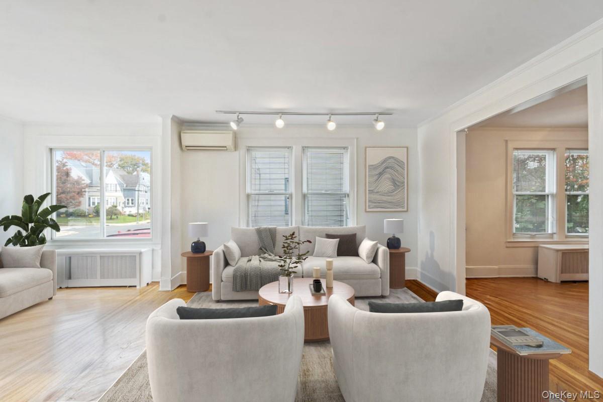 80 Munro Boulevard Valley Stream, NY 11581 - Photo 5 of 28 a living room with furniture and a large window