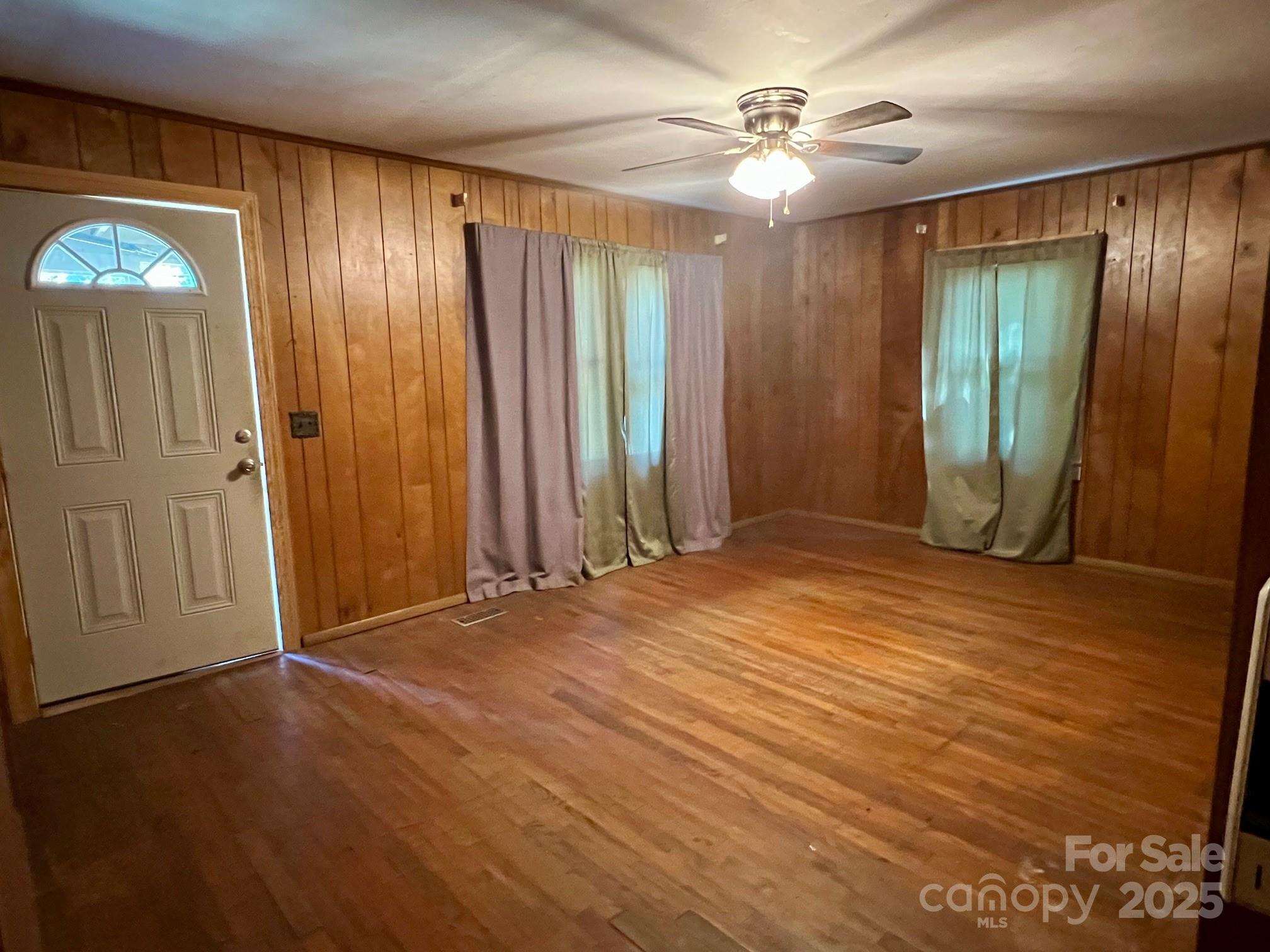 295 D D. Mathis Drive Rutherfordton, NC 28139 - Photo 4 of 11 wooden floor in an empty room with a window