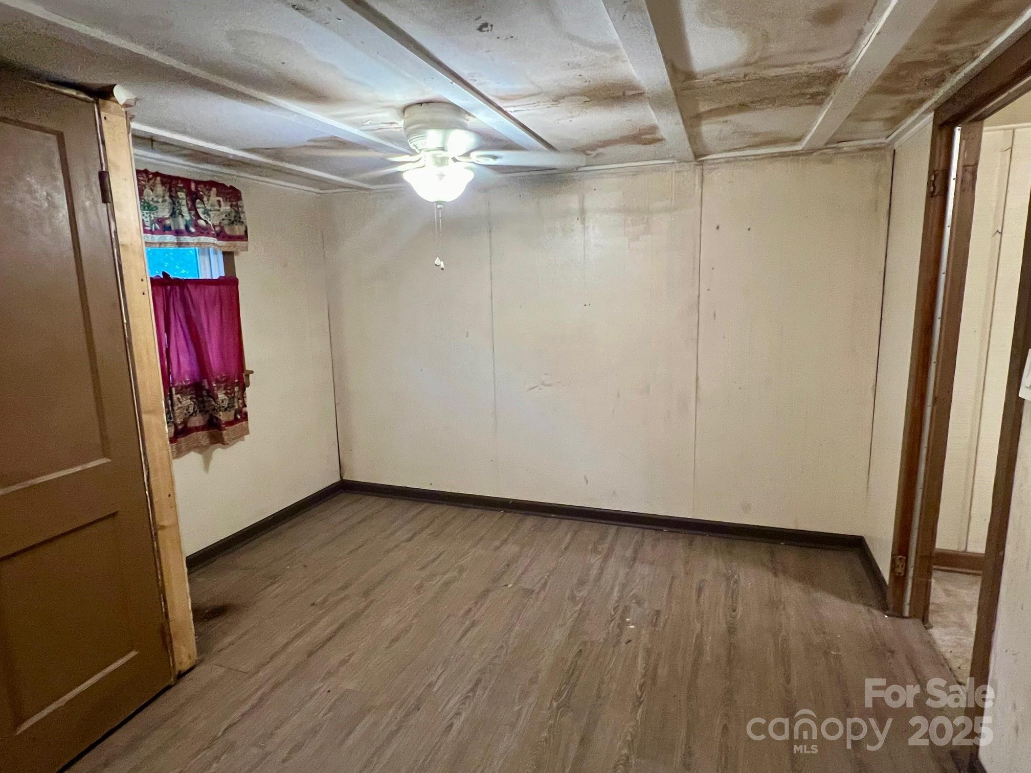 295 D D. Mathis Drive Rutherfordton, NC 28139 - Photo 6 of 11 a view of a hallway with wooden floor and chandelier