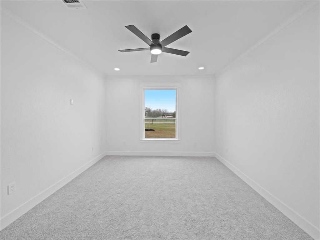 145 Cartwright Park Road Weatherford, TX 76087 - Photo 23 of 27 a view of an empty room with a window