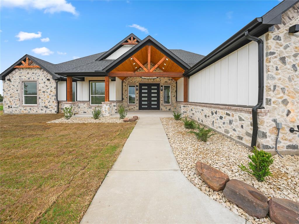 145 Cartwright Park Road Weatherford, TX 76087 - Photo 3 of 27 a front view of a house with garden