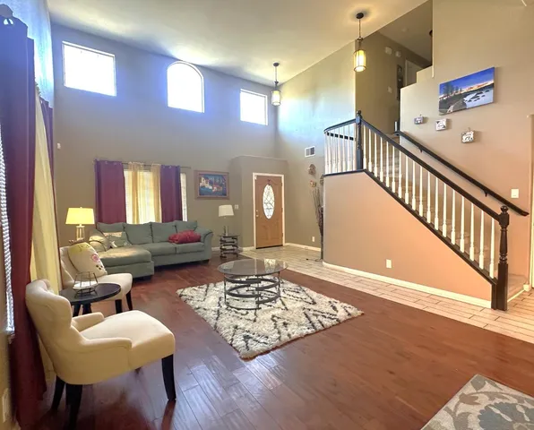 a living room with furniture and a table
