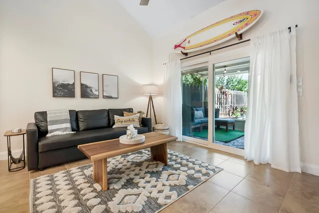 a living room with furniture and a rug