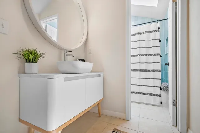 a bathroom with a sink and a mirror