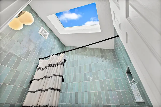 a bathroom with a sink and mirror