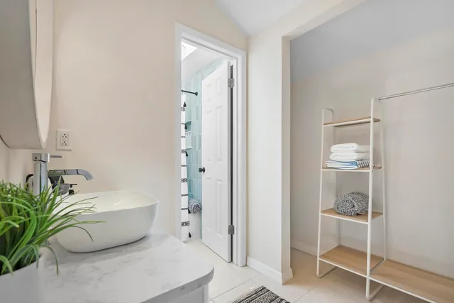 a bathroom with a bathtub and shower