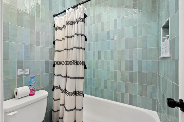 a bathroom with a bathtub and shower