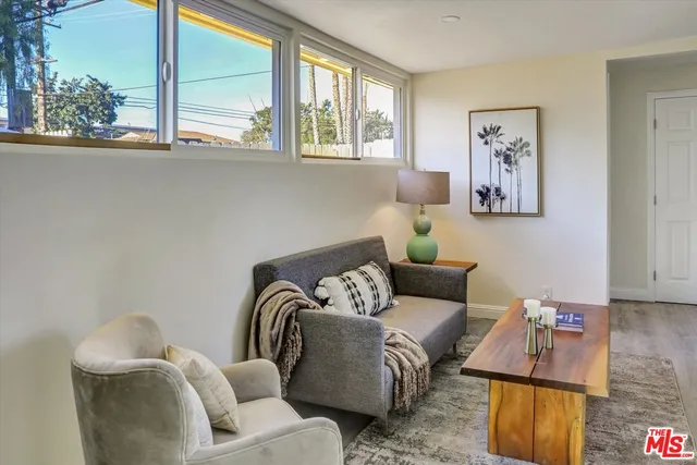 a living room with furniture and window