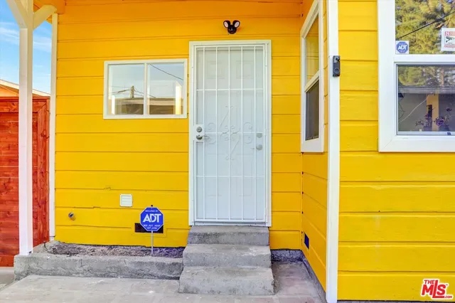 a view of door and small yard