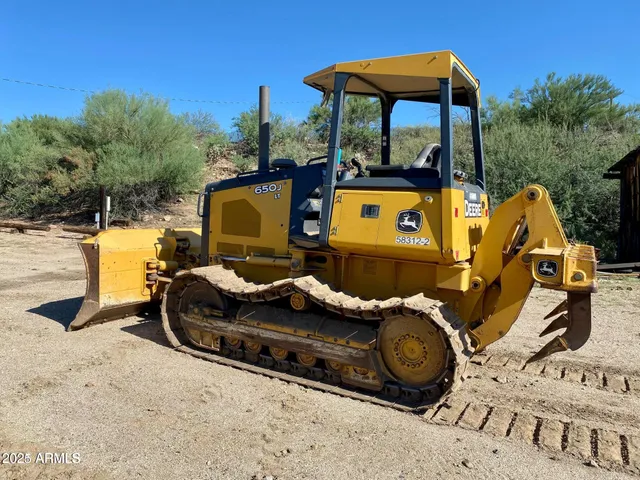 a view of a wooden street with a view of roof
