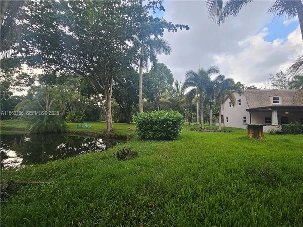 a view of a house with a big yard