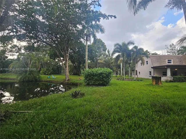 a view of a house with a big yard