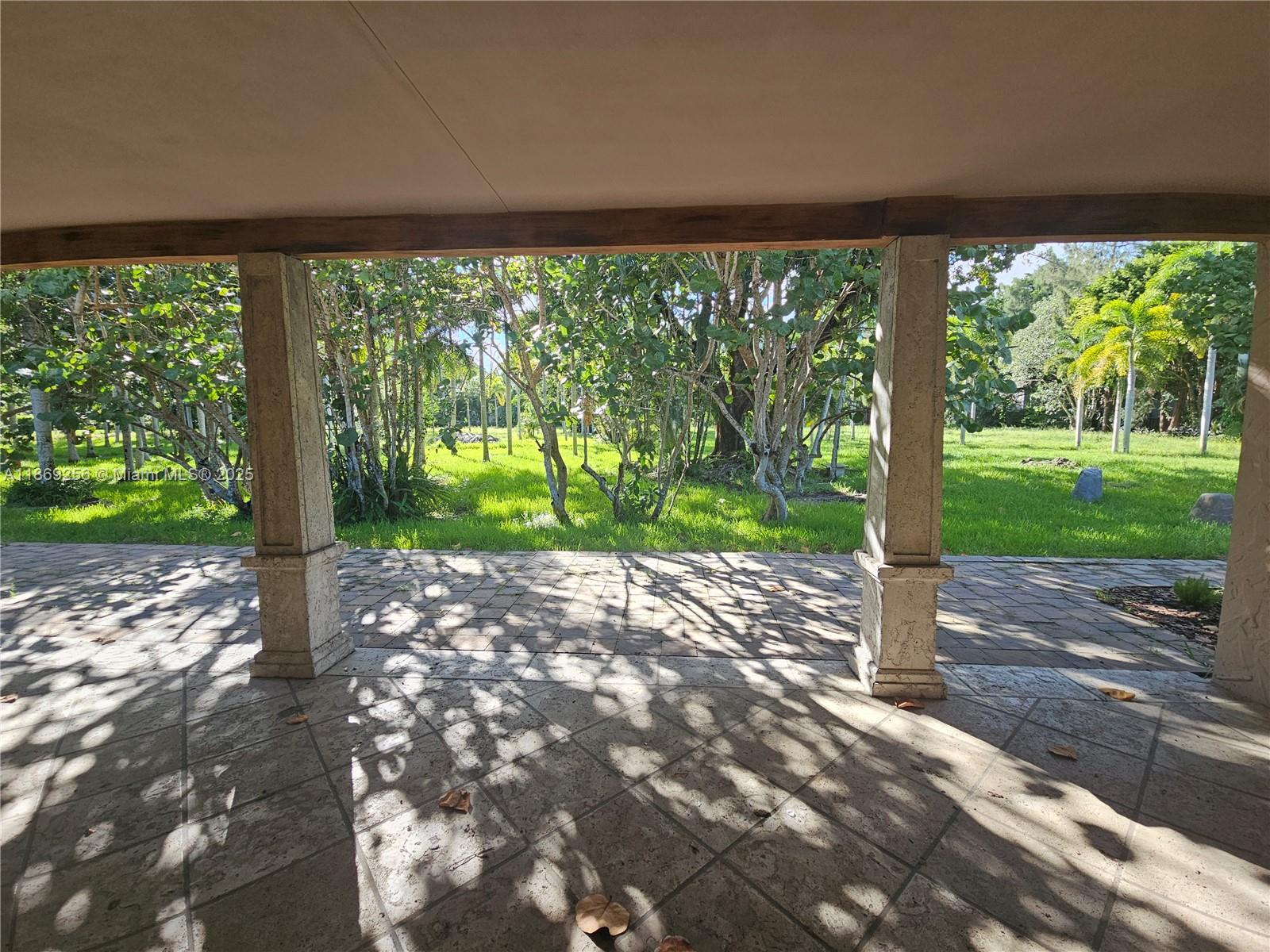 15101 Southwest 27th Street Davie, FL 33331 - Photo 21 of 43 a view of a porch with a yard