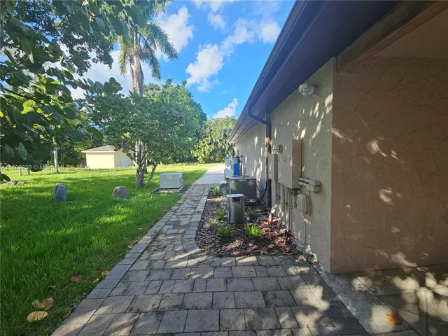 a view of a garden with a pathway