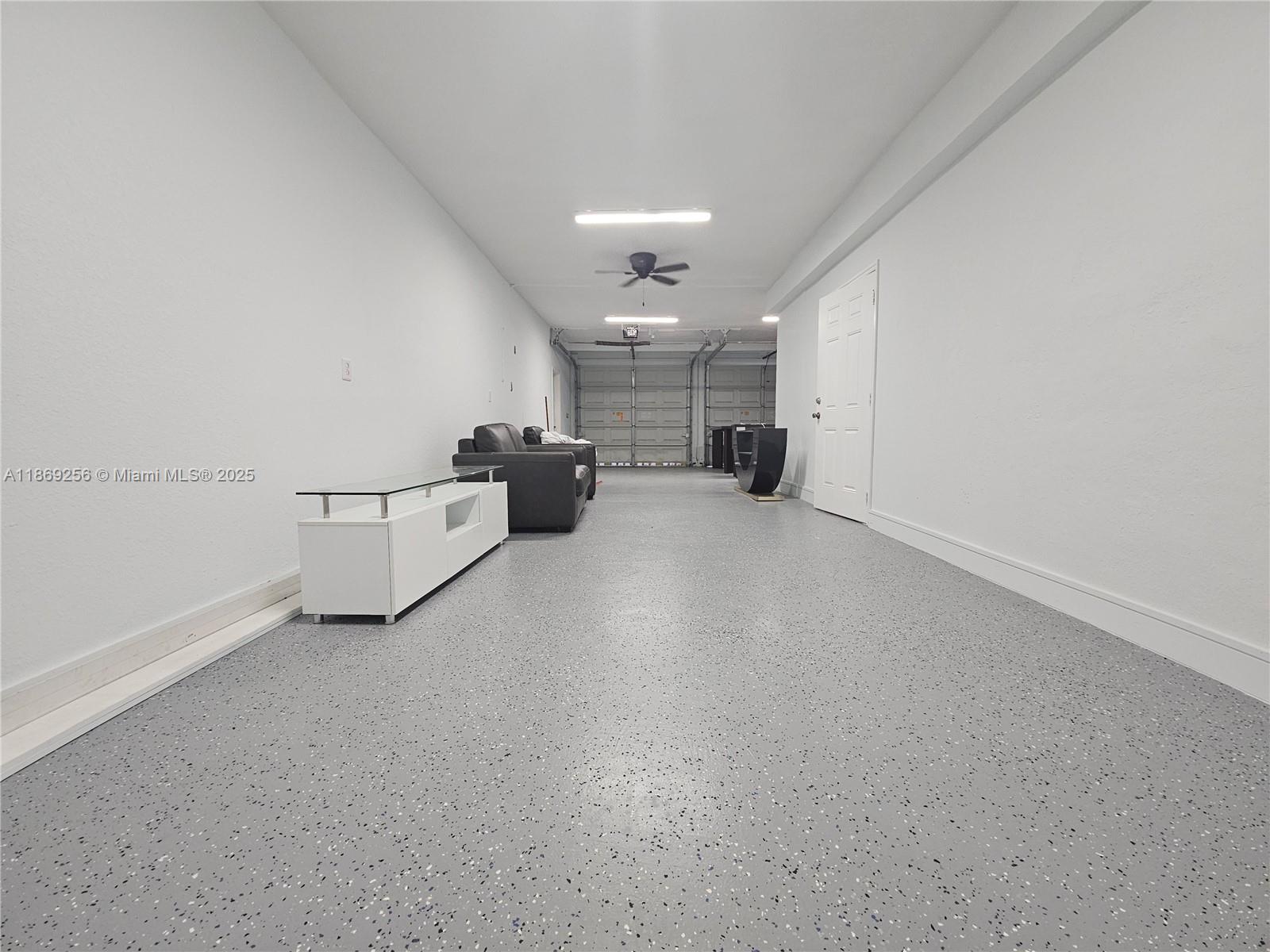 15101 Southwest 27th Street Davie, FL 33331 - Photo 28 of 43 an empty room with chandelier fan and windows