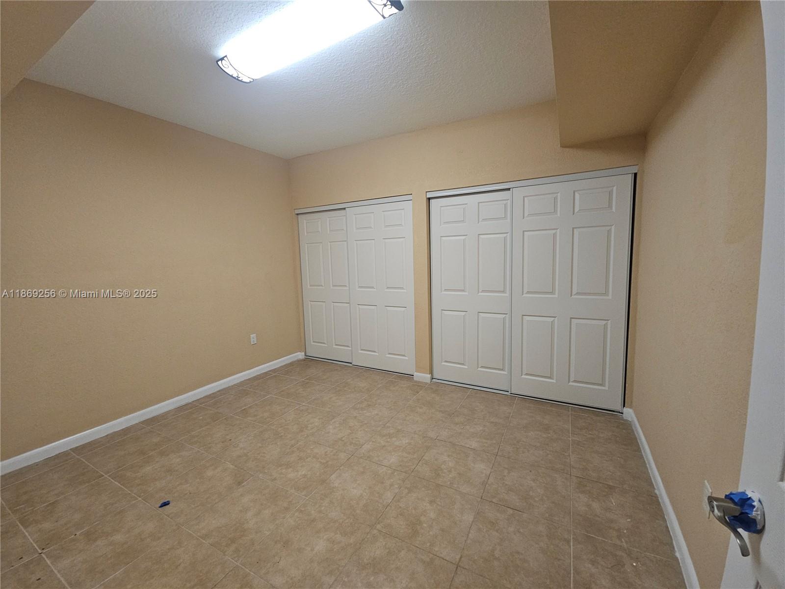 15101 Southwest 27th Street Davie, FL 33331 - Photo 32 of 43 an empty room with closet area