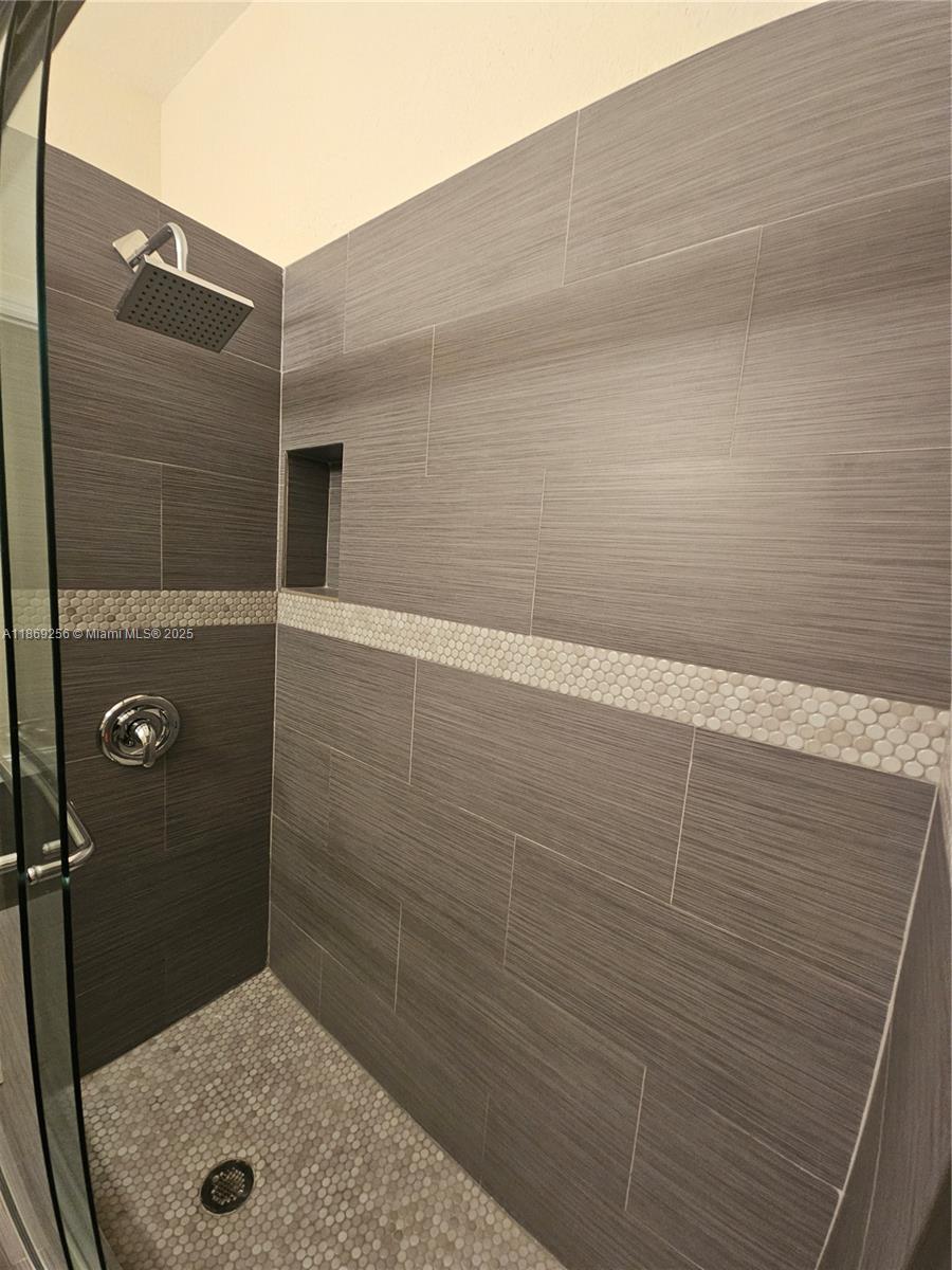 15101 Southwest 27th Street Davie, FL 33331 - Photo 39 of 43 a bathroom with a shower