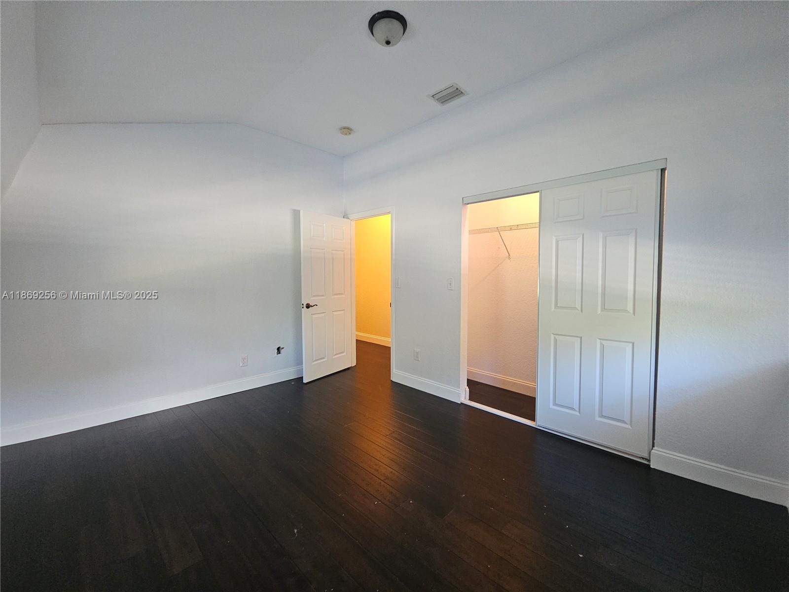 15101 Southwest 27th Street Davie, FL 33331 - Photo 43 of 43 an empty room with wooden floor and windows