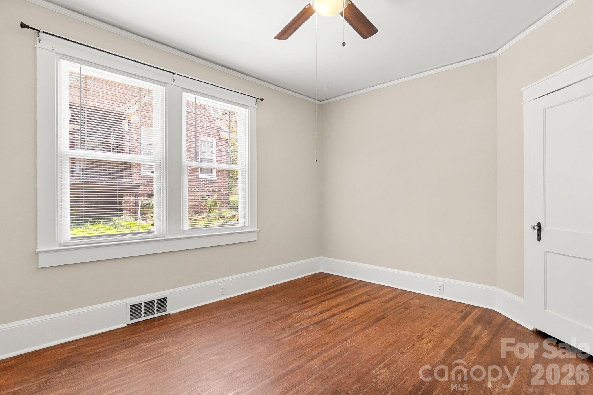 108 Reedy Street Chester, SC 29706 - Photo 27 of 42 a view of an empty room with wooden floor and a window