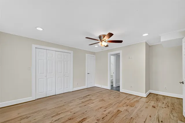 a bathroom with a granite countertop sink a light fixture and a mirror