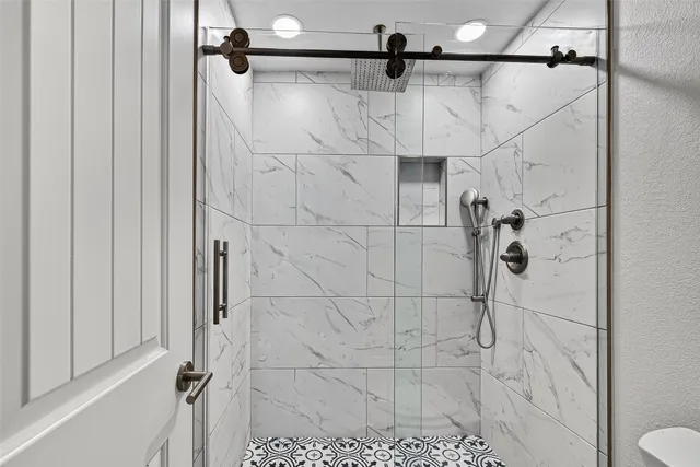 a view of a bedroom with wooden floor and cabinet