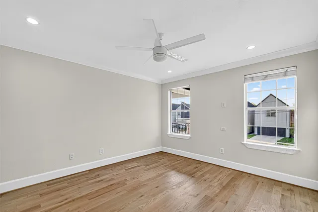 wooden floor in an empty room with a window