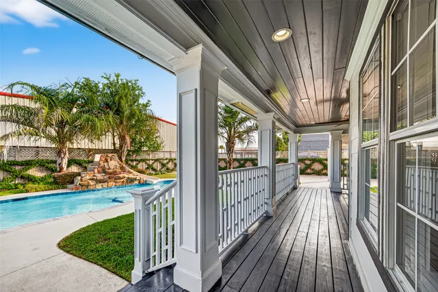 a bathroom with a granite countertop sink a mirror and a shower