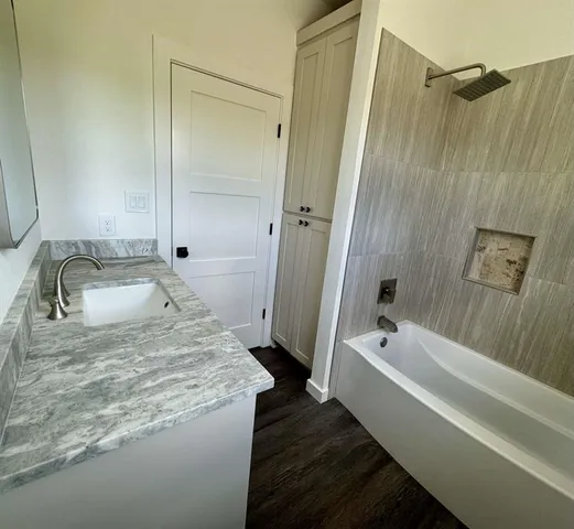 a bathroom with a sink and a tub
