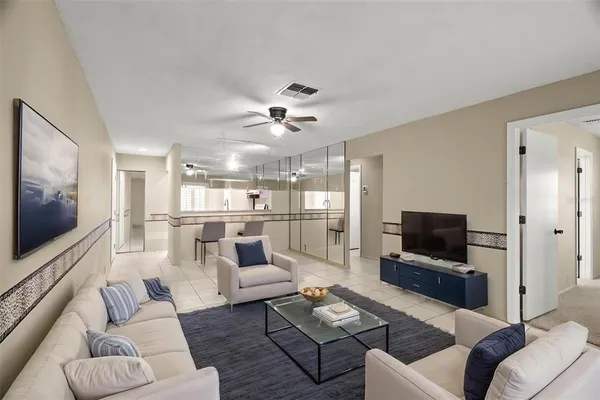 a living room with furniture and a flat screen tv