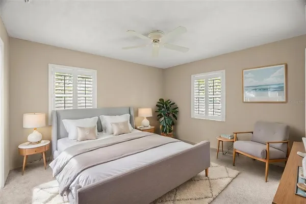 a bedroom with a bed and a couch