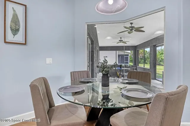 a view of a dining room with furniture window and outside view